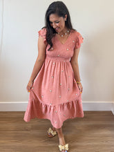 Load image into Gallery viewer, Model wearing Delaney Daisy Dress in Sienna: v-neck, smocked bodice, flutter sleeves, daisy embroidery, midi, lined.