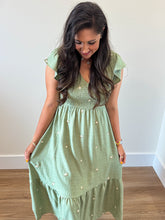 Load image into Gallery viewer, Delaney Daisy Dress in sage green with smocked bodice, flutter sleeves, and white daisy embroidery.